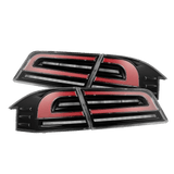 12-21 Tesla Model S LUXX-Series LED Tail Lights Black Red (With Black Trunk Center Piece Replacement) | AlphaRex